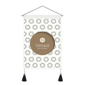 Detail of vintage wall tapestry featuring teal patterns, wooden rod and black tassels