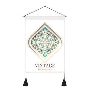 Detailed macro view of a Nordic style mandala wall hanging tapestry with black tassels