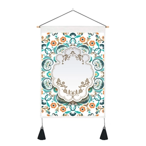 Close-up of scroll-style wall tapestry with floral patterns and wooden hanging rod