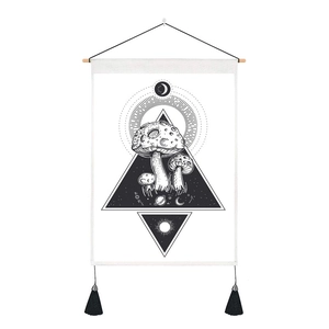 Detail of mystic mushroom tapestry with celestial motifs and elegant black tassels