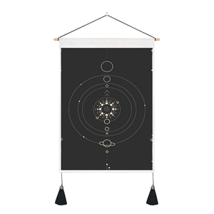 Detail of Nordic tarot tapestry with astronomical orbits and minimalist wooden hanger