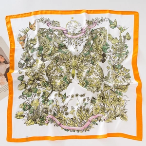 Detail of vintage butterfly and floral print silk scarf with orange contrast border