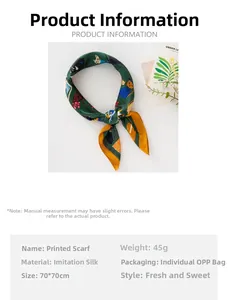 Detail of faux silk square scarf featuring colorful cartoon cat prints on green base