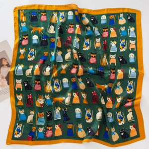 Green silk square scarf featuring cute cartoon cat prints and yellow contrast border