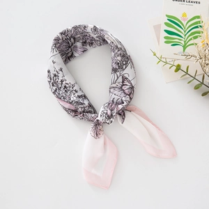 Elegant floral butterfly print faux silk square scarf with pink edges on clean background
