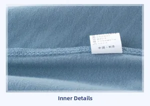 Vue détaillée de la texture du coton bleu et des coutures intérieures soignées de l'ourlet