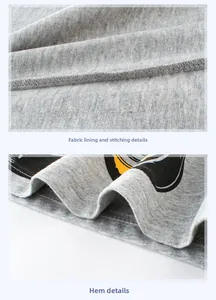 Close-up of boys' grey cotton T-shirt showing inner fabric texture and double-stitch hem