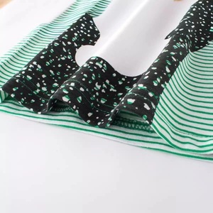Green and white striped kids T-shirt with irregular polka dots and premium double stitching