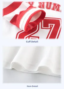 Detail view of red and white striped cuffs and vintage 27 print on kids cotton shirt