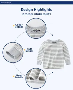 Detail view of lucky print collar, elastic cuffs and hem on girls striped long sleeve tee