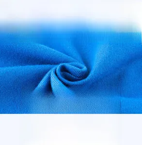Macro shot of sky blue knitted fabric showing soft breathable texture for baby clothing