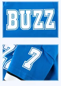 Detail view of bright blue kids long sleeve shirt with BUZZ lettering and number 7 print