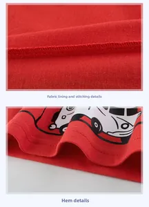 Detail of red cotton knit t-shirt showing interior stitching and cartoon car print hem