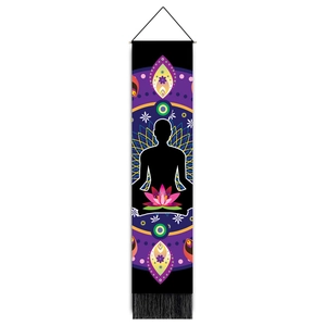Detail of meditation tapestry featuring silhouette, pink lotus, and black decorative tassels