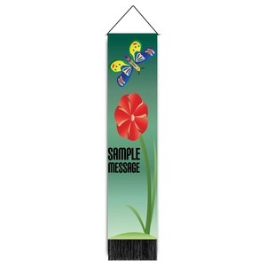 Detailed view of butterfly and red flower wall tapestry with black decorative fringe