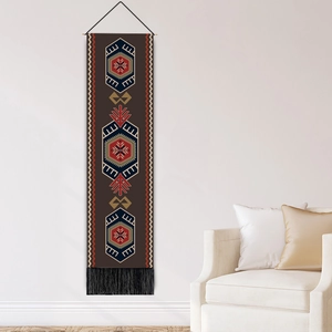 Bohemian geometric wall tapestry with tribal patterns and tassels on white wall