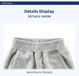 Dettaglio della fascia elastica rinforzata in vita sui pantaloni sportivi grigi per bambini