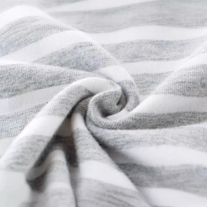 Kids grey and white striped t-shirt with soft cotton knit fabric detail in macro view