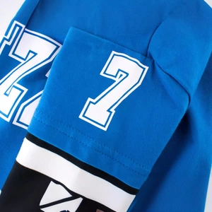 Blue sporty long sleeve tee for boys featuring a white number 7 print on the sleeve