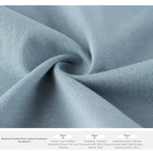 Macro detail of soft blue cotton fabric with GB standard textile safety safety safety info