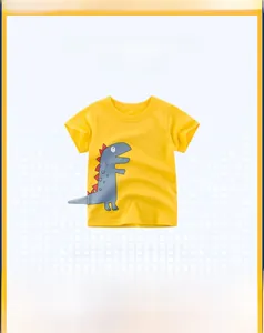 Detail of yellow cotton kids T-shirt with 3D dinosaur tail design and cartoon print