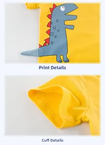 Detail view of yellow cotton t-shirt with cartoon dinosaur print and sleeve stitching