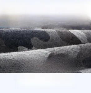 Macro detail of soft breathable camouflage knit fabric for boys sports pants