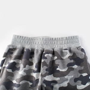 Boys gray camouflage sports pants featuring elastic ribbed waistband and detailed stitching