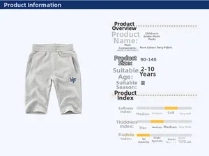 Dettaglio dei pantaloni sportivi grigi in cotone con ricamo a squalo per bambini 2-10 anni