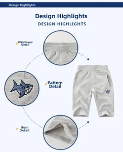 Dettagli dei pantaloncini in maglia grigi per bambini con ricamo squalo e vita elastica