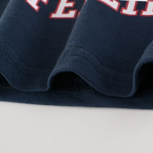 Dark blue boys' cotton knit T-shirt featuring varsity style letter print and twin-needle hem