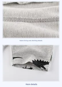 Détail de la doublure avec coutures et imprimé dinosaure sur l'ourlet du short enfant