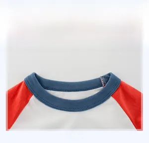 Close-up of ribbed crew neck and raglan sleeve stitching on kids cotton t-shirt
