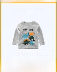 Detail of grey cotton long-sleeve kids T-shirt featuring colorful dinosaur prints