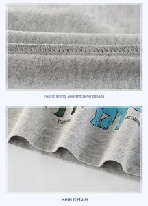 Detail of gray cotton knit fabric showing neat stitching and cartoon dinosaur print