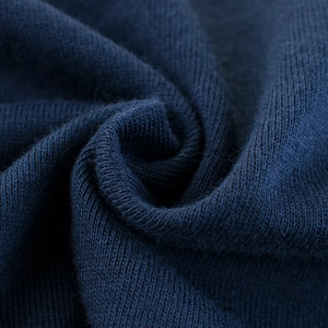Close-up of navy blue knitted cotton fabric texture with soft breathable finish for kids T-shirt