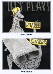 Detail showing cartoon dinosaur print and ribbed cuffs on black cotton kids T-shirt