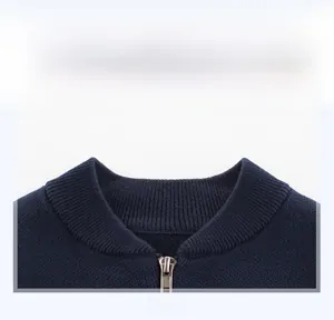 Detail of ribbed neckline and metal zipper on deep blue knitted children's cardigan