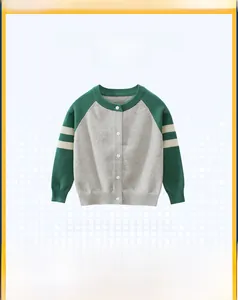 Detail of kids knit cardigan with grey and green color block design and white buttons