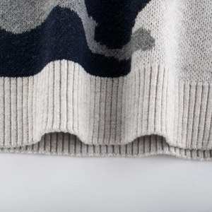 Kids camo knit sweater featuring navy and grey camouflage pattern and ribbed hem