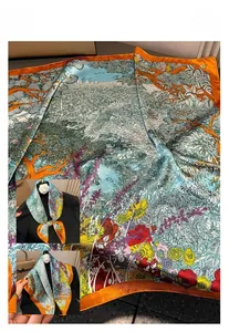 Detail of silk-like scarf featuring vintage floral prints and urban landscape patterns