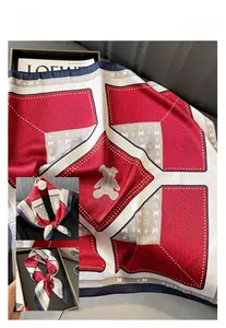 Detail of satin square scarf with geometric bear print and tricolor patchwork design