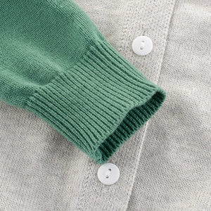 Kids color-block knit sweater featuring ribbed cuffs and white decorative buttons