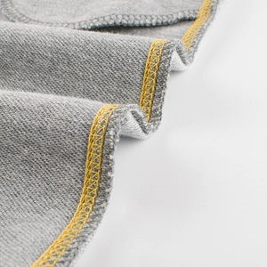 Kids grey knitted joggers with contrast yellow stitching and soft loopback texture