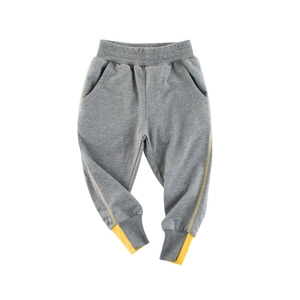 Gray cotton kids sports joggers with elastic waist and yellow side stripe detail