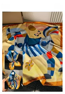 Detail of silk-like satin square scarf with colorful geometric patterns and pony prints