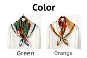 Detail of silk satin scarf featuring vintage ginkgo prints draped on a white shirt collar
