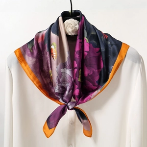 Elegant floral print silk square scarf tied around a white shirt collar for women