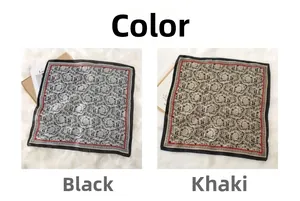 Detailansicht der Seidenschals mit Vintage-Rosen und barocken Schnörkelmustern