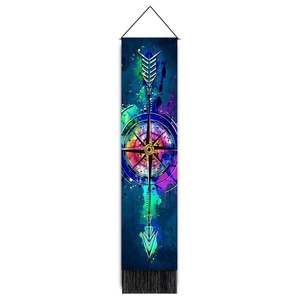 Detail of colorful compass and arrow canvas wall scroll with wooden bar and black tassels